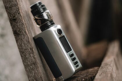 an electronic device sitting on top of a wooden bench