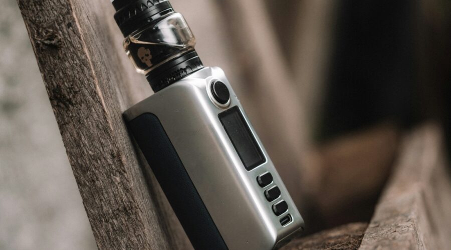 an electronic device sitting on top of a wooden bench